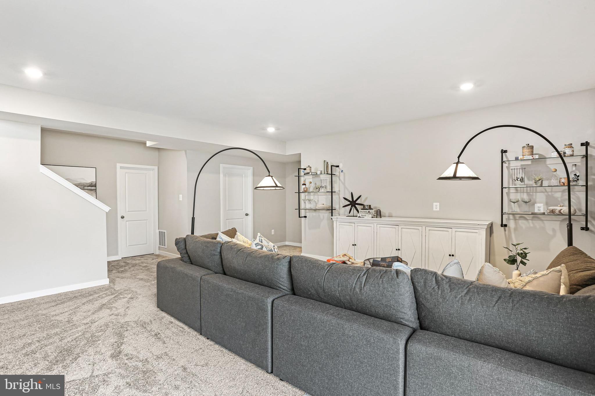 Shenandoah Springs Shenandoah Springs, Unit BRIARS Ranson, WV 25438 - Photo 21 of 23 a living room with furniture and a large window