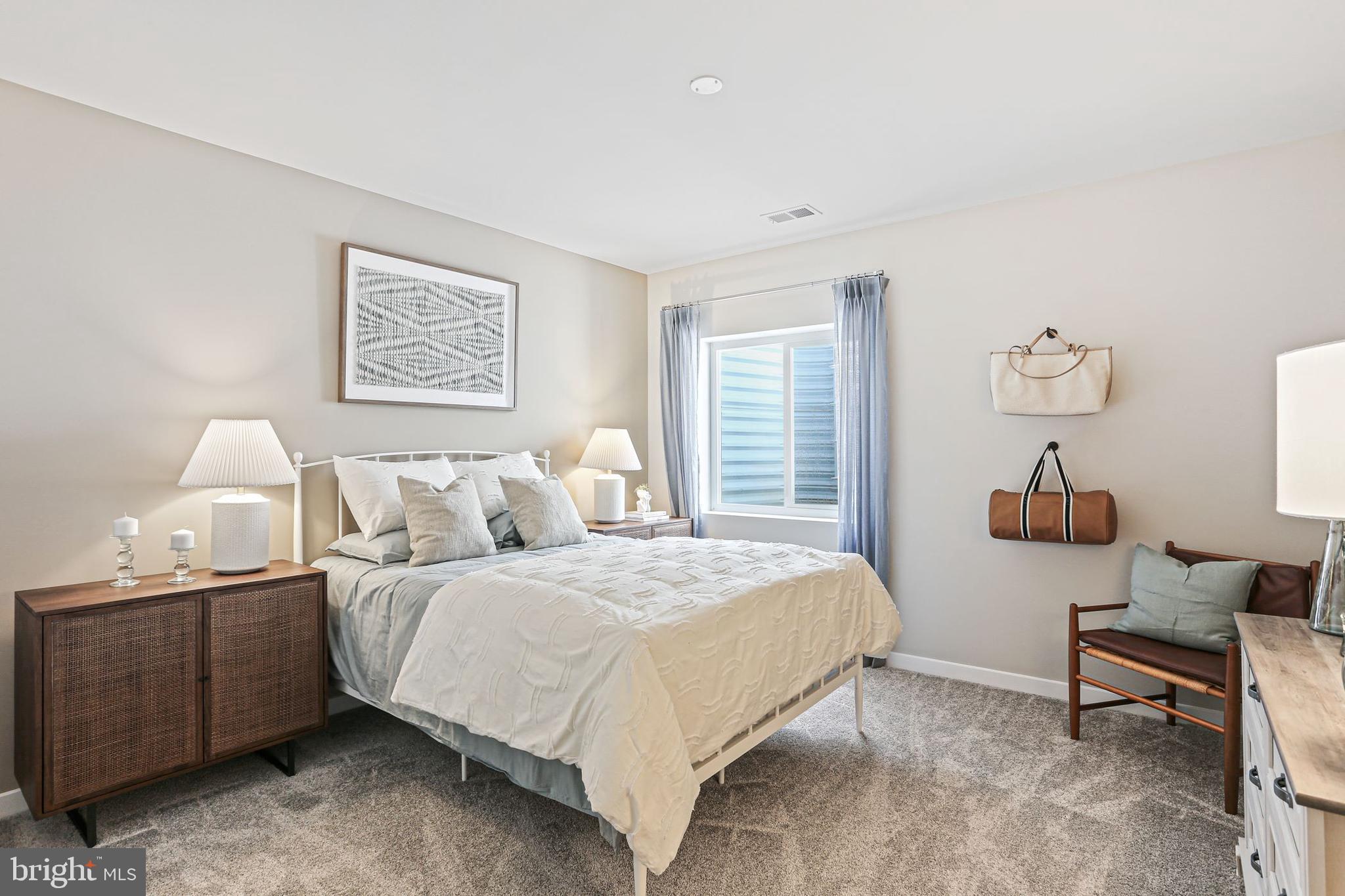 Shenandoah Springs Shenandoah Springs, Unit BRIARS Ranson, WV 25438 - Photo 23 of 23 a bedroom with a bed a couch and a window