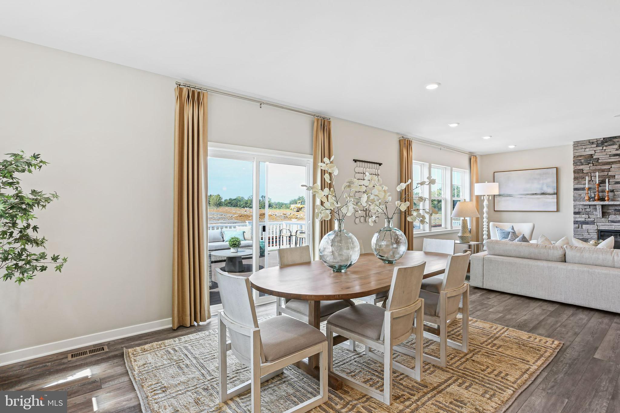 Shenandoah Springs Shenandoah Springs, Unit BRIARS Ranson, WV 25438 - Photo 7 of 23 a view of a dining room with furniture window and wooden floor