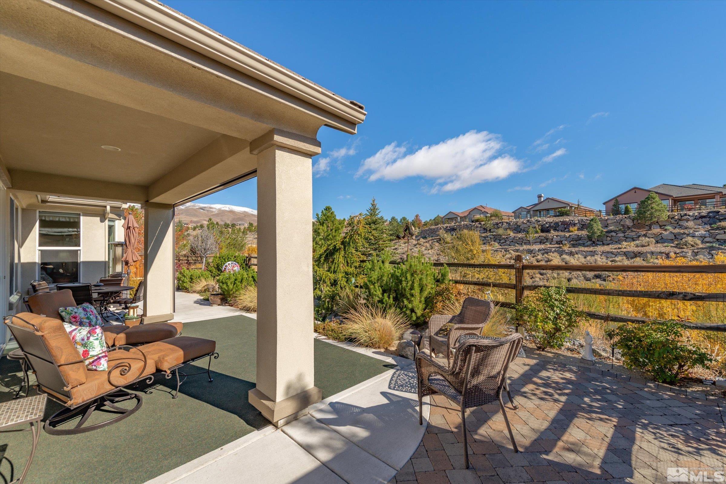 1340 Winterchase Way Reno, NV 89523 - Photo 34 of 40 a view of a chairs and table in patio with a lake view