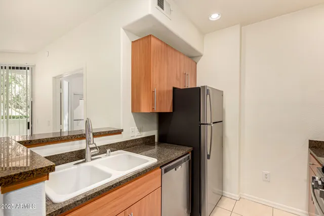 a kitchen with a sink and a refrigerator