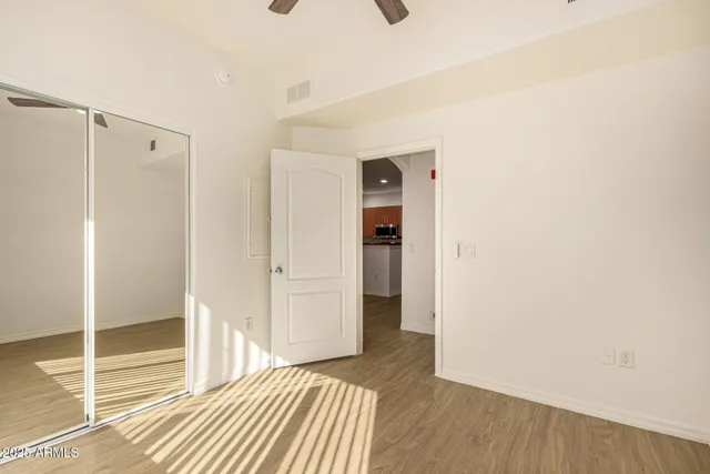 a view of a room with wooden floor