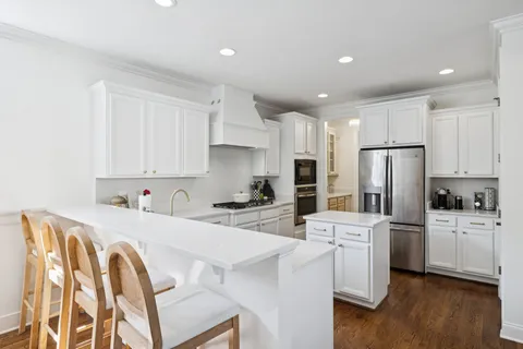 a living room with fireplace furniture and a flat screen tv