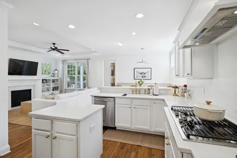 a spacious bathroom with a granite countertop sink and a mirror