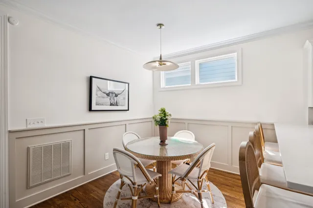 a bathroom with a sink a toilet and a window