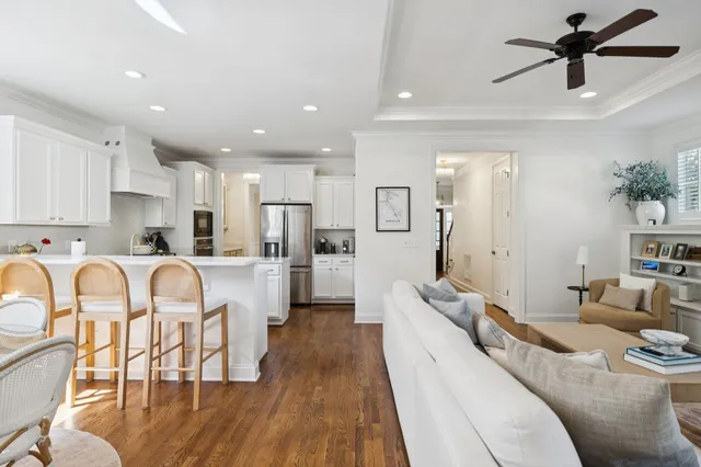 a spacious bedroom with a bed and a dresser