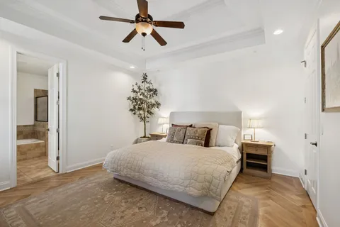 a view of a bedroom with a bed and a window