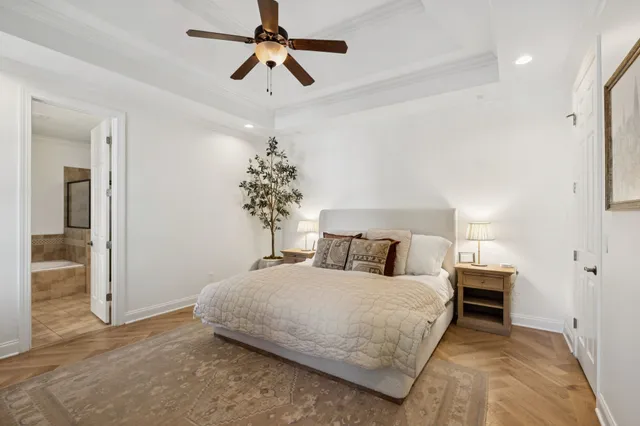 a view of a bedroom with a bed and a window