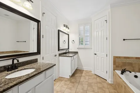 a living room with couches and a table with wooden floor