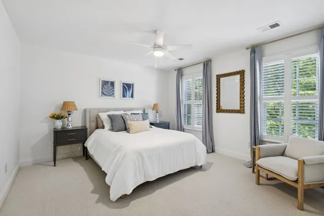 a view of a house with backyard sitting area and garden