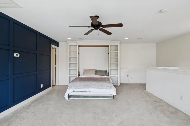 an aerial view of a houses with a lake view