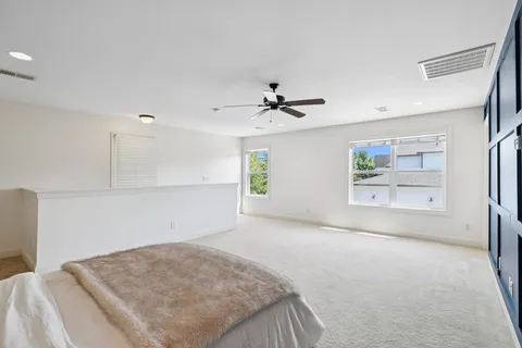 an aerial view of a house with a yard