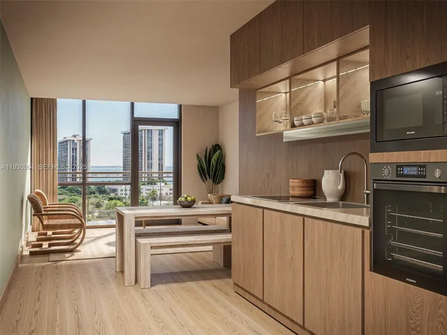a kitchen with stainless steel appliances a sink and cabinets