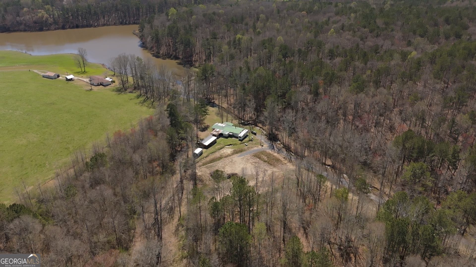 a aerial view of a house with a yard