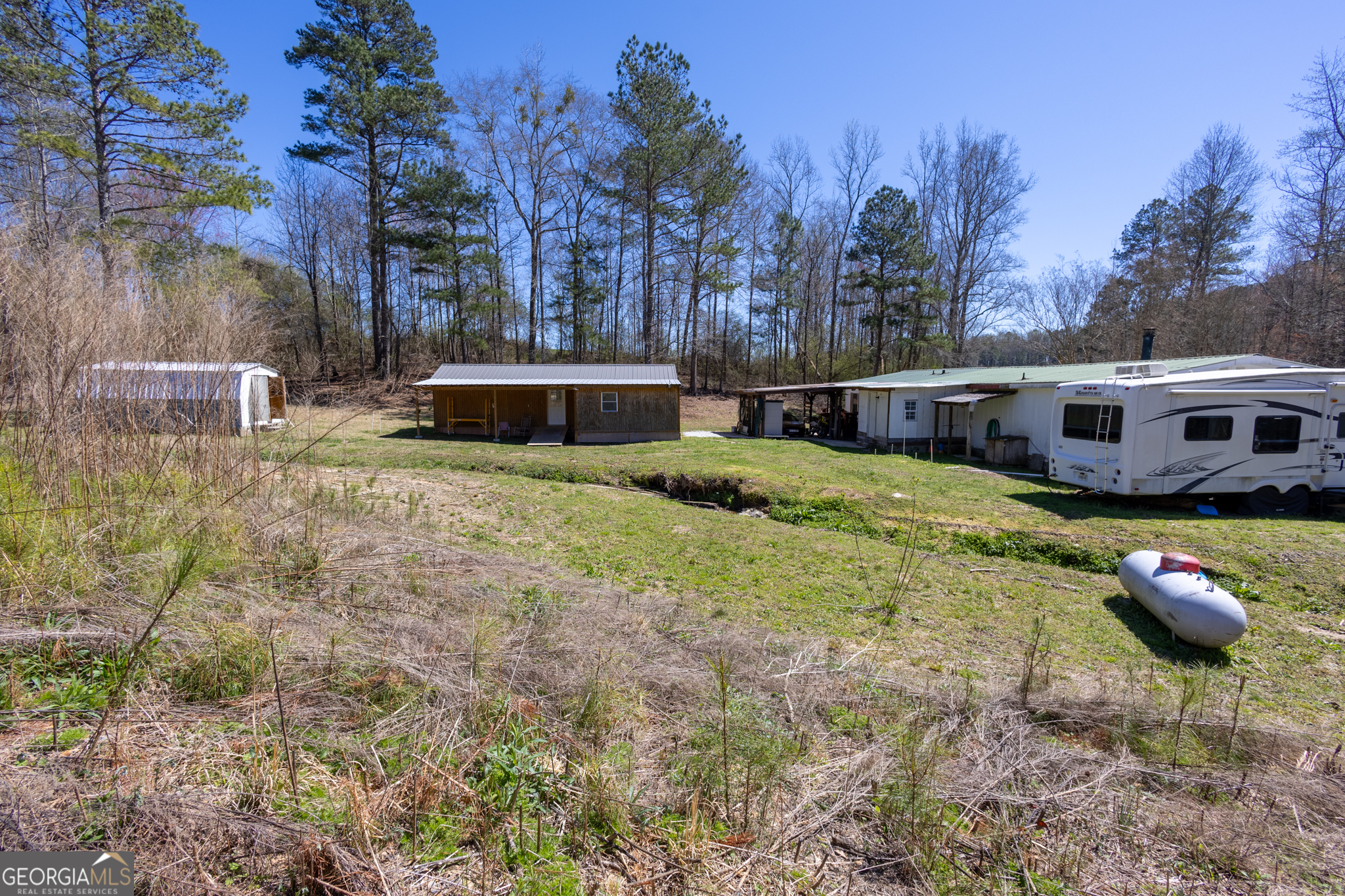 727 County Road 677 Ranburne, AL 36273 - Photo 11 of 24 a view of a house with backyard and sitting area