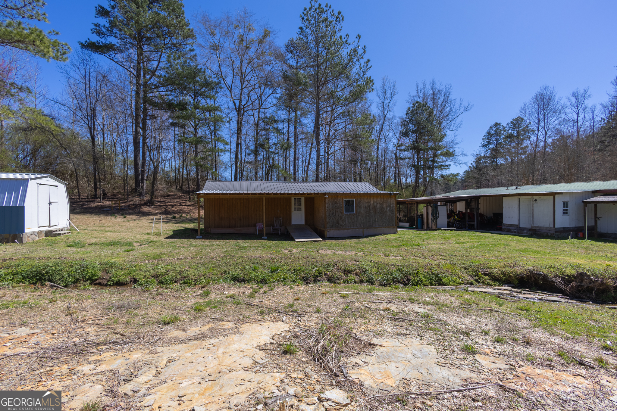 727 County Road 677 Ranburne, AL 36273 - Photo 13 of 24 a view of a house with backyard and trees
