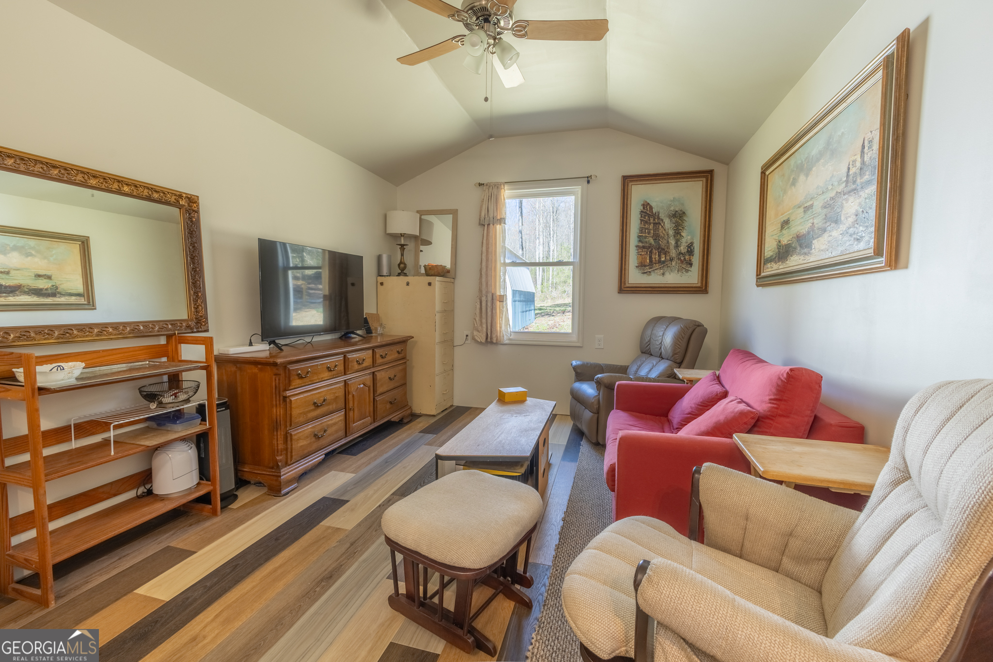 727 County Road 677 Ranburne, AL 36273 - Photo 2 of 24 a living room with furniture a flat screen tv and a window