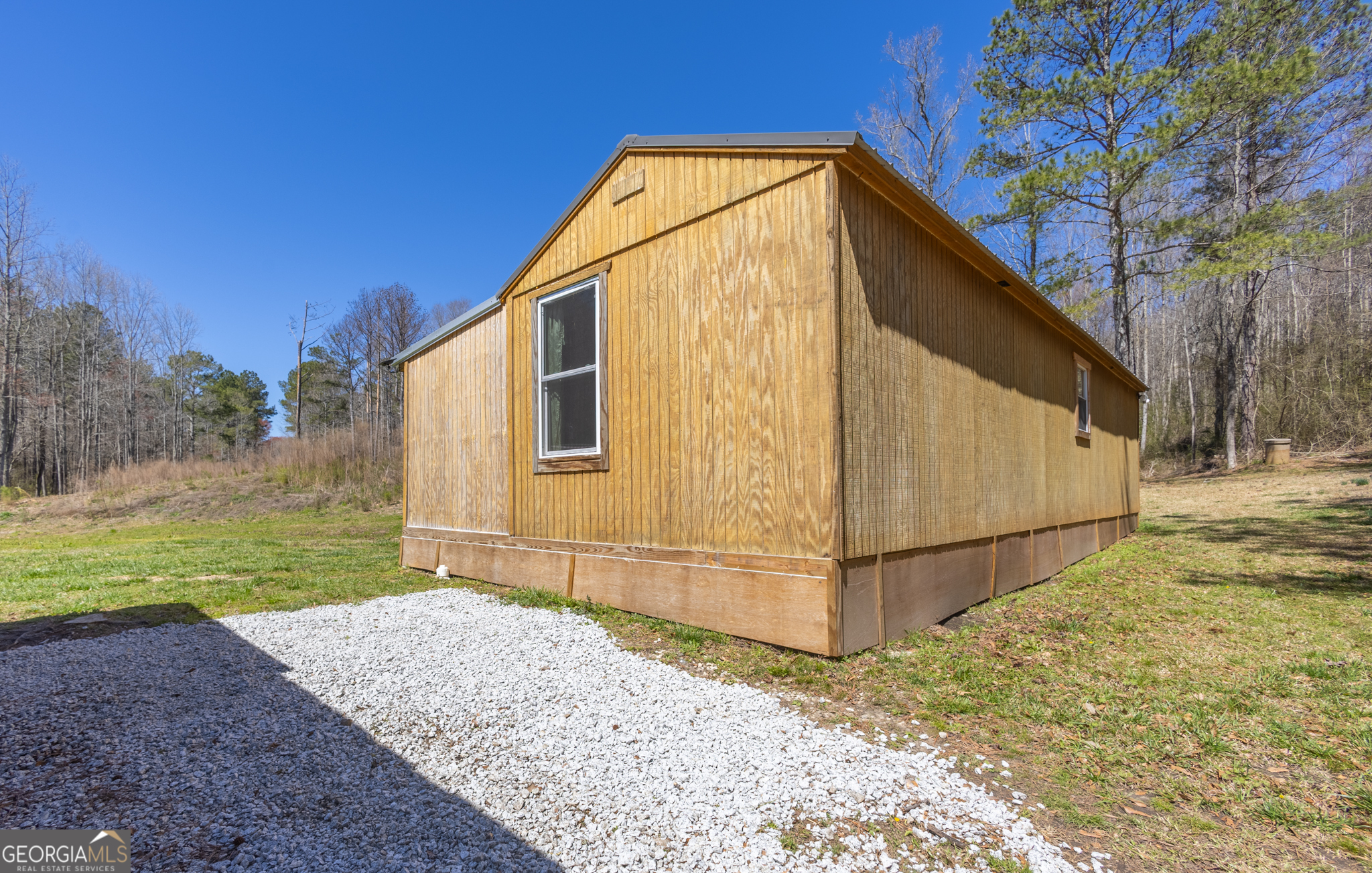 727 County Road 677 Ranburne, AL 36273 - Photo 10 of 24 a view of backyard of house and trees