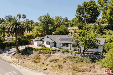 a house with a tree in the background