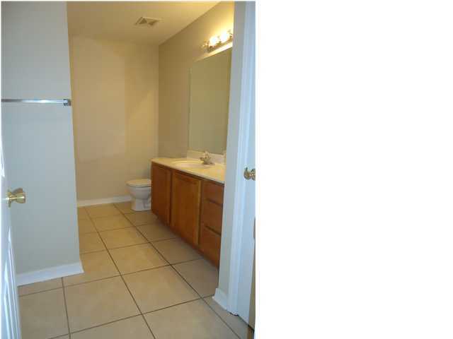 2877 Aplin Road Crestview, FL 32539 - Photo 11 of 17 a bathroom with a sink and a mirror