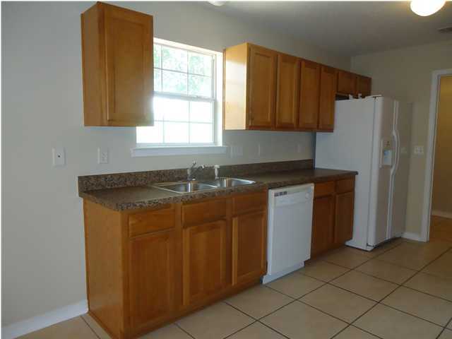 2877 Aplin Road Crestview, FL 32539 - Photo 4 of 17 a utility room with a sink washer and dryer