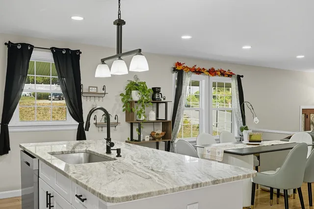 a kitchen with a sink and a large window