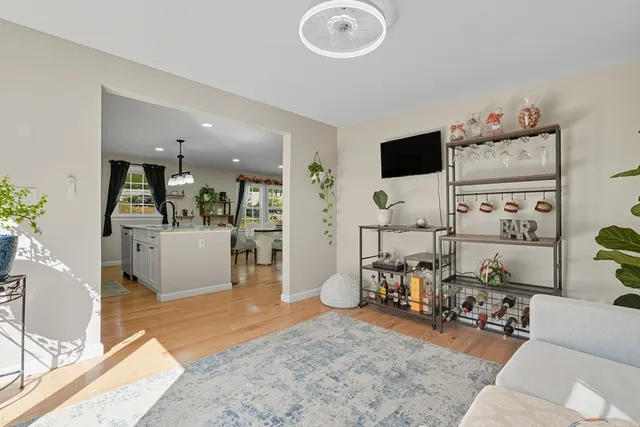 a living room with furniture and flat screen tv