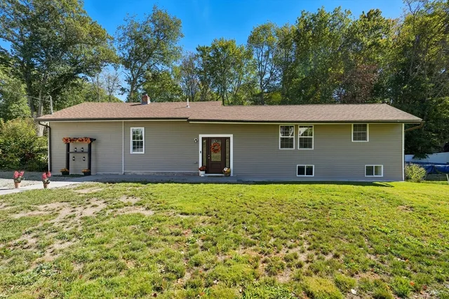 a house with trees in the background