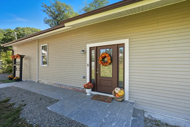 a view of a wooden door with a bench