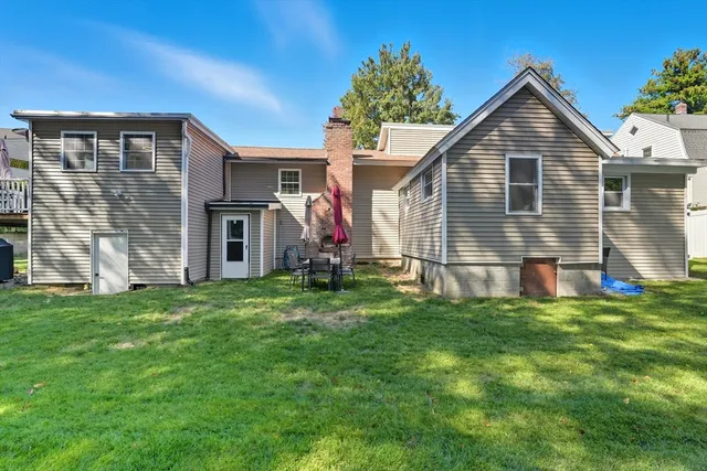 a front view of house with yard and seating area