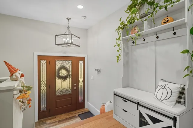 walk in closet with wooden floor