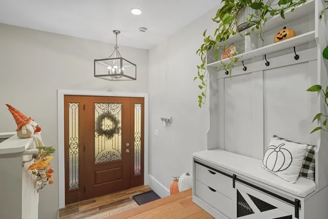 walk in closet with wooden floor