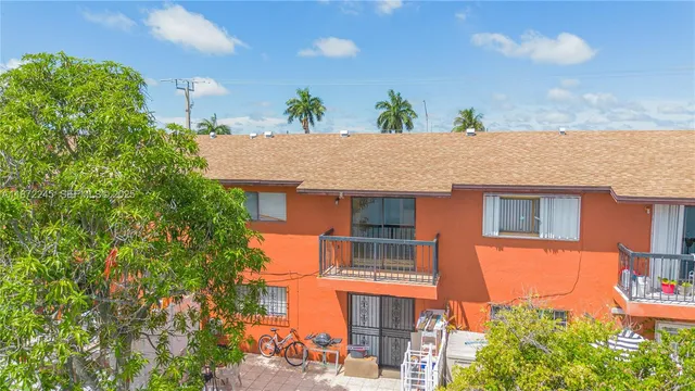 an aerial view of ocean and residential houses with outdoor space and lake view
