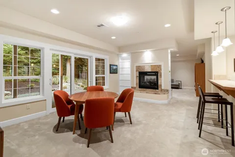 a dining room with furniture and fireplace