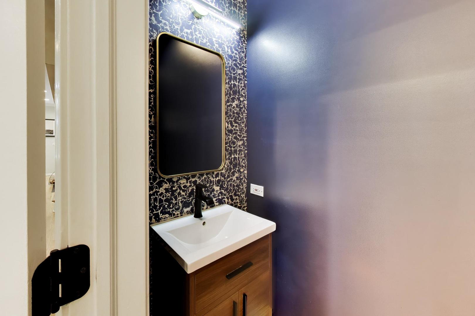 232 West Scott Street Chicago, IL 60610 - Photo 10 of 39 a bathroom with a sink and a mirror