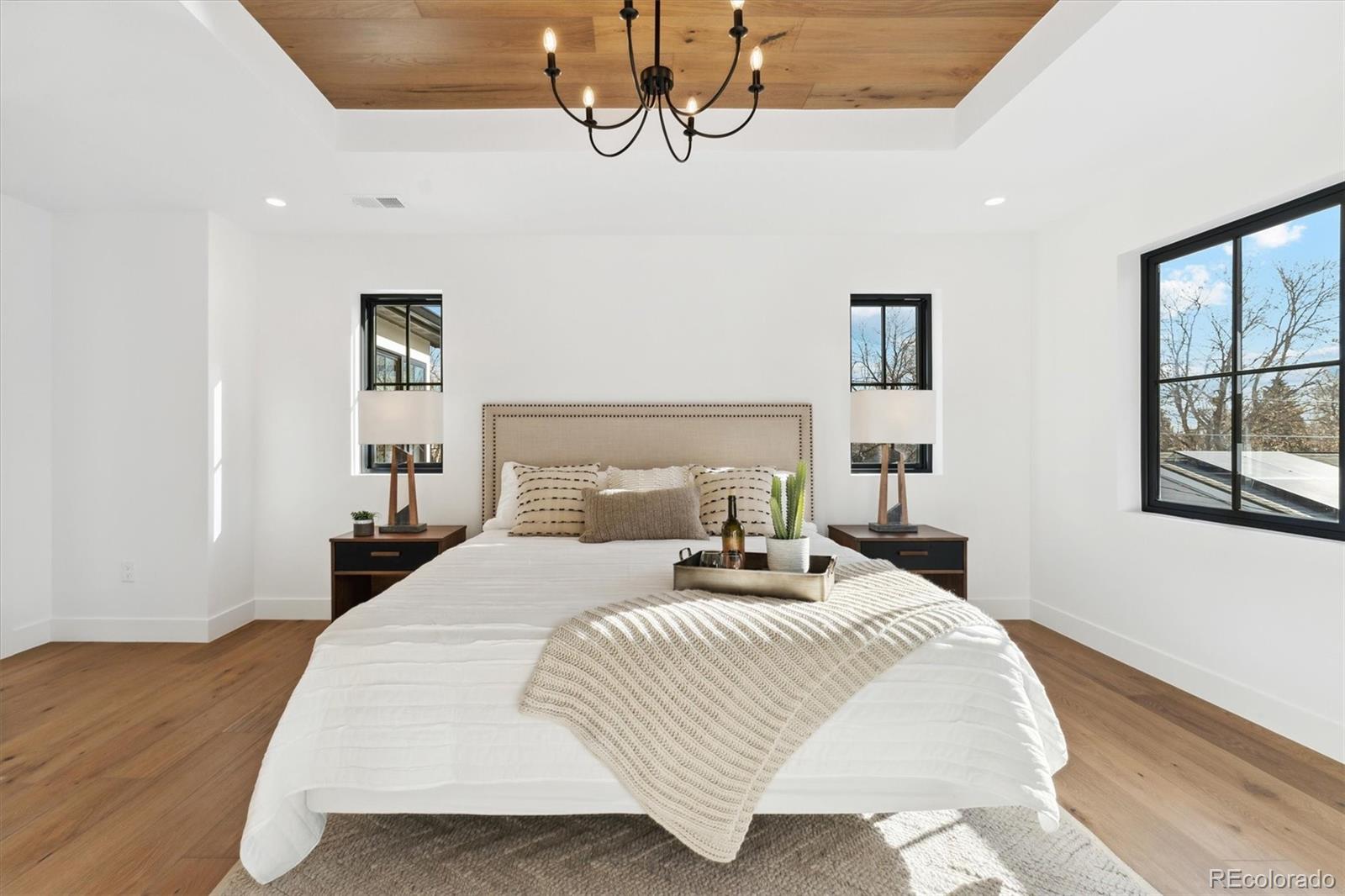 2540 Jay Street Edgewater, CO 80214 - Photo 22 of 37 a bedroom with a large bed and a window
