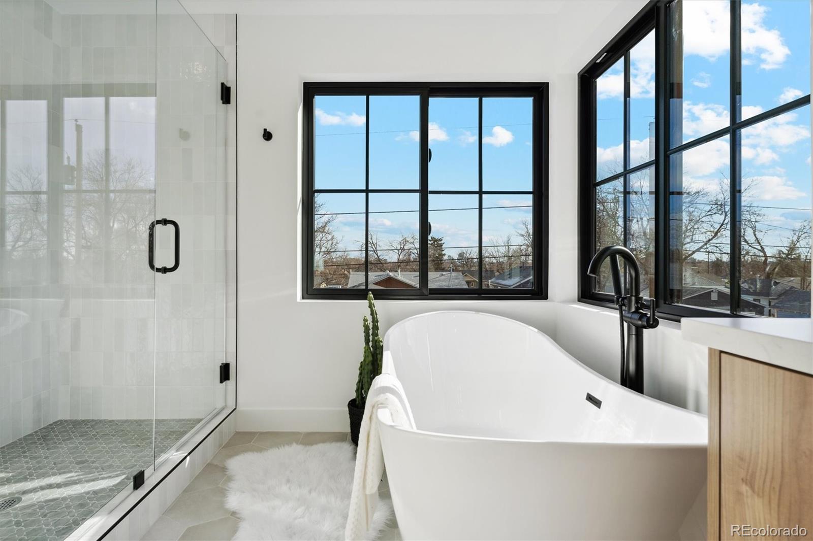 2540 Jay Street Edgewater, CO 80214 - Photo 26 of 37 a bathroom with a bathtub and a window