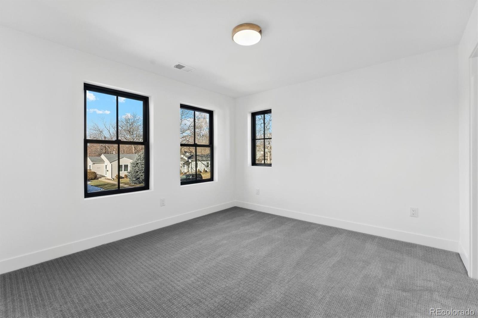2540 Jay Street Edgewater, CO 80214 - Photo 30 of 37 an empty room with windows and closet