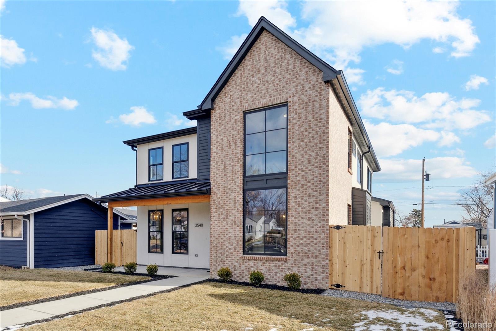 2540 Jay Street Edgewater, CO 80214 - Photo 35 of 37 a front view of a house with a yard