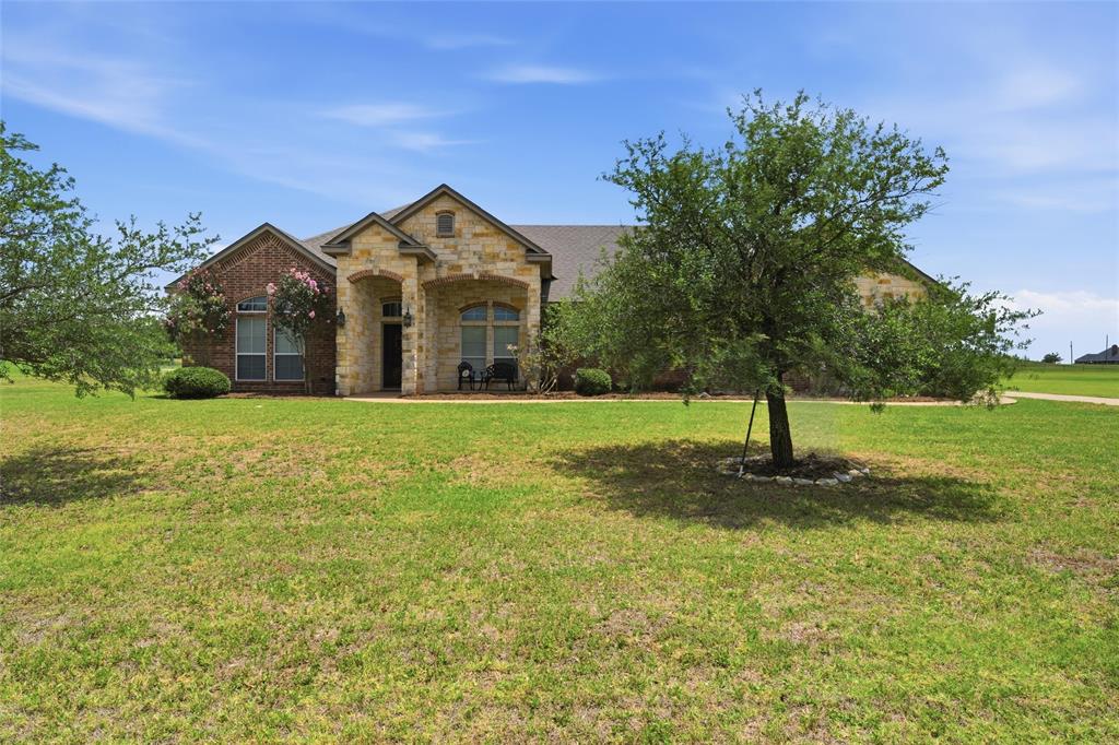 845 County Line Road West West, TX 76691 - Photo 2 of 36 Brick and stone facade residence featuring an arched portico entry