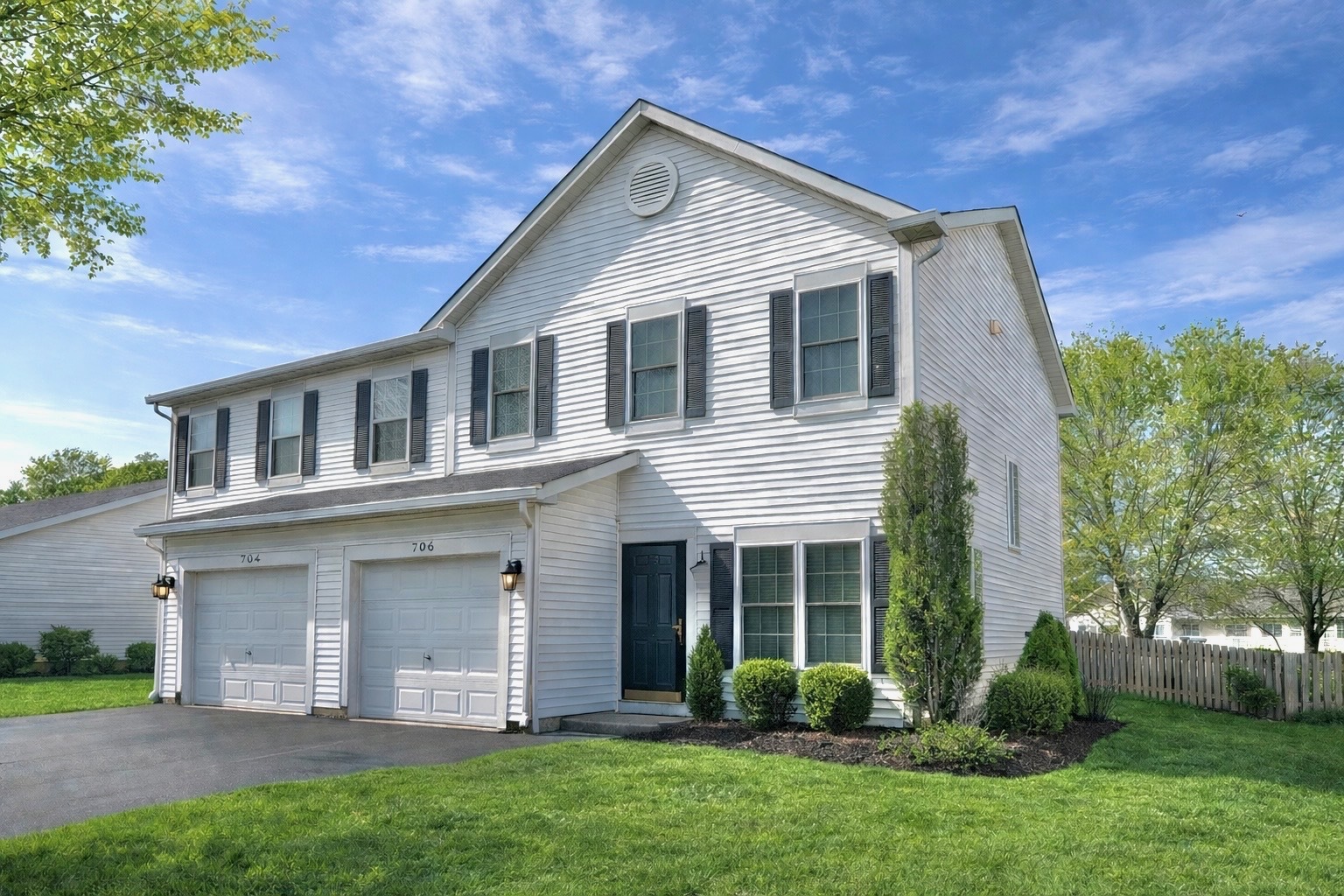 front view of a house with a yard
