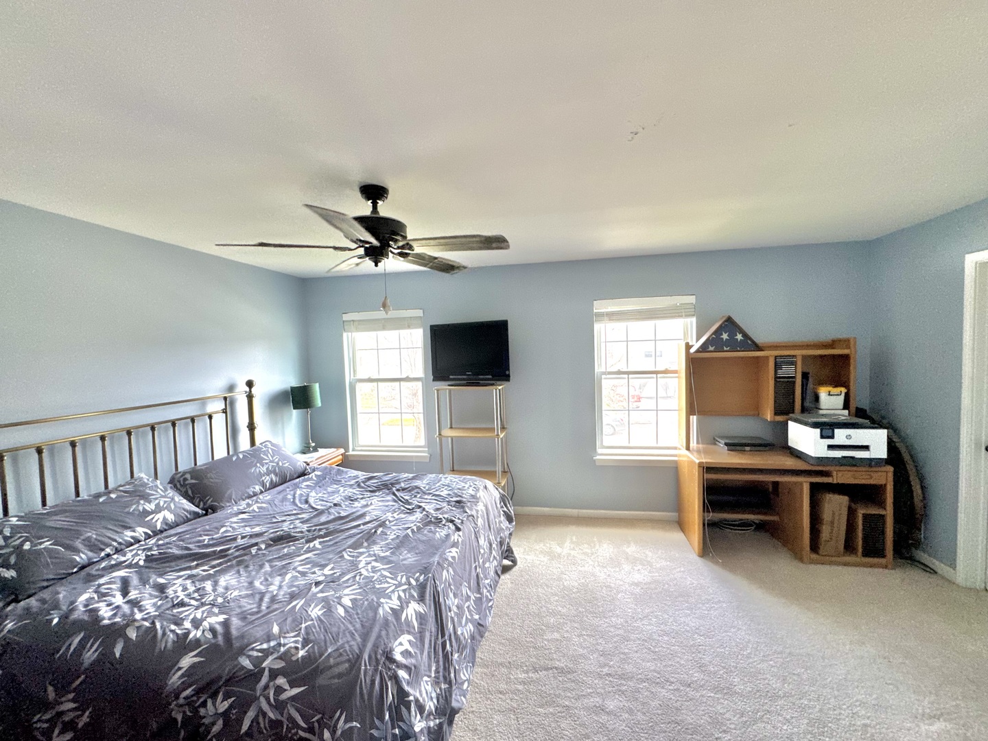 704 Shannon Drive Romeoville, IL 60446 - Photo 4 of 10 a bedroom with a bed and a chandelier