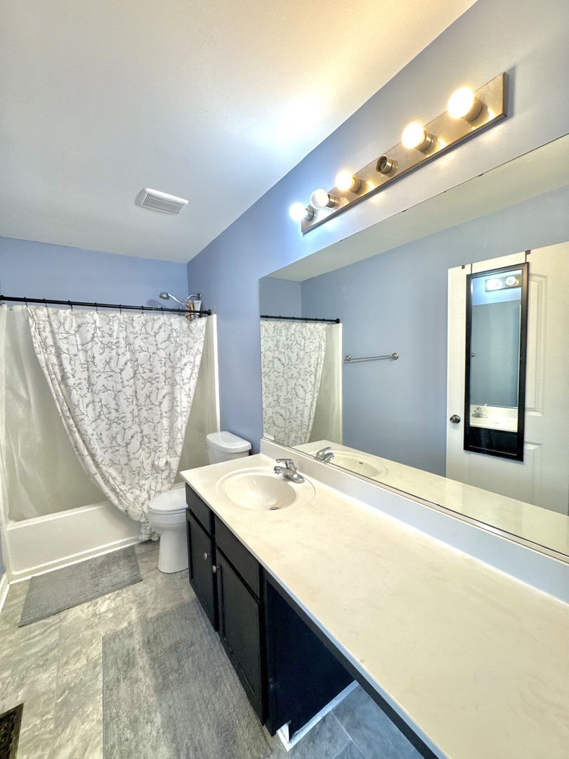 704 Shannon Drive Romeoville, IL 60446 - Photo 6 of 10 a spacious bathroom with a sink double vanity and a mirror