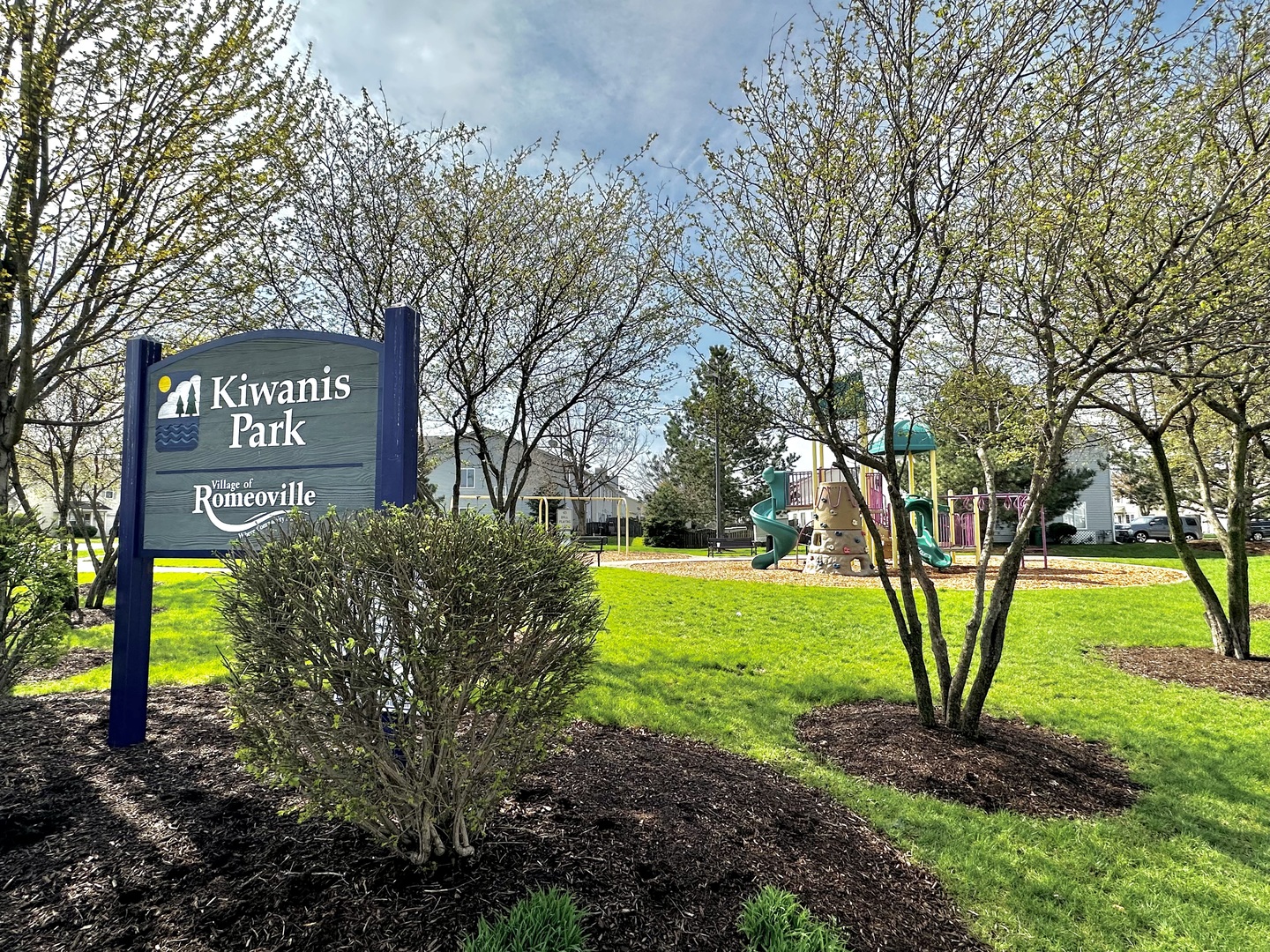 704 Shannon Drive Romeoville, IL 60446 - Photo 7 of 10 a sign that is sitting in front of a tree