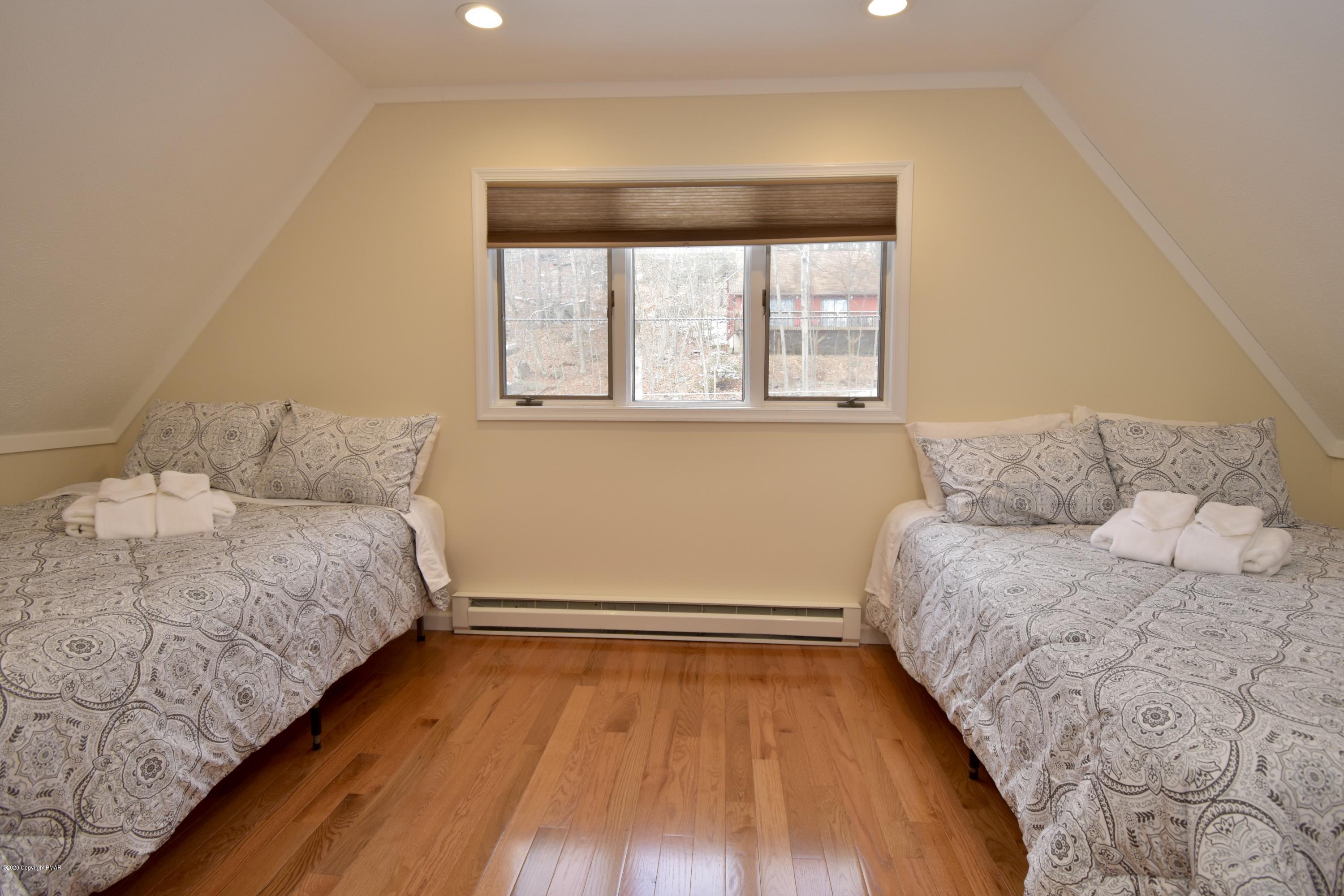 163 Canterbury Road Bushkill, PA 18324 - Photo 18 of 36 a bedroom with a bed and a window