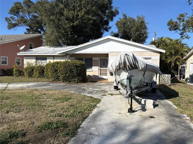 a view of a backyard with a sitting area and furniture
