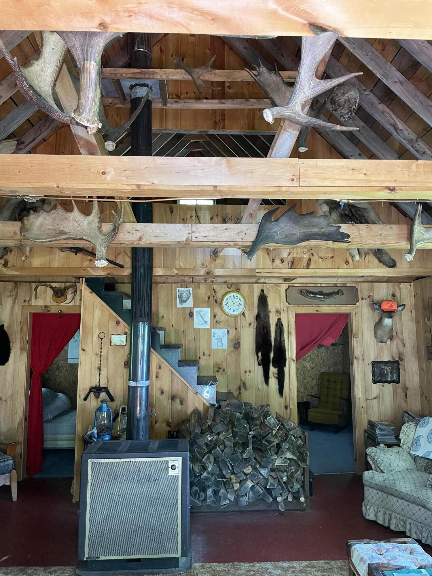 25 No Road West Forks, ME 04945 - Photo 14 of 22 wood stove living room open