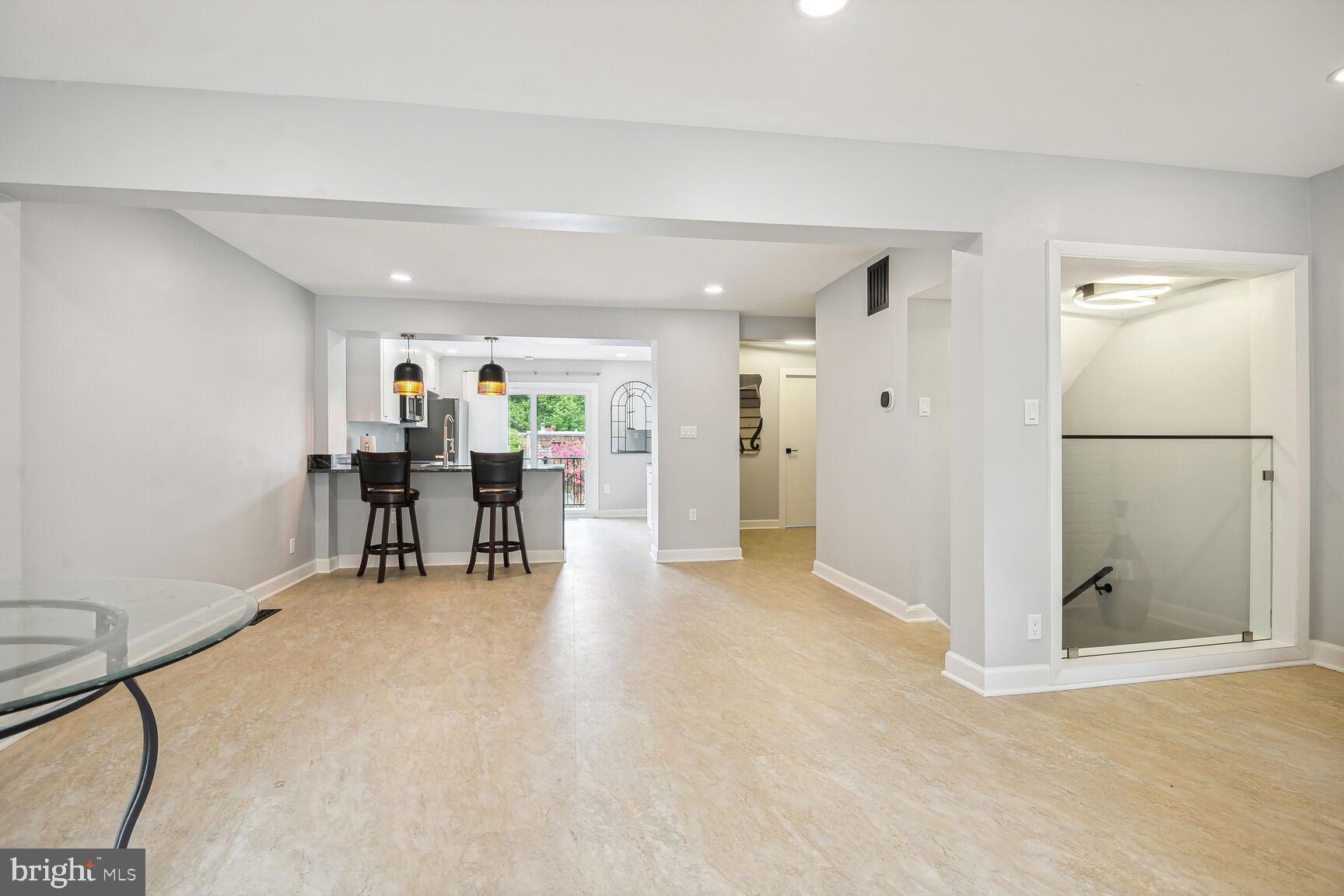 1635 Valencia Way Reston, VA 20190 - Photo 11 of 22 a view of a livingroom with furniture and a kitchen