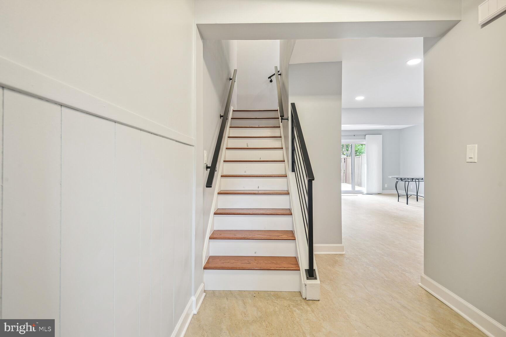 1635 Valencia Way Reston, VA 20190 - Photo 14 of 22 a view of a hallway with staircase