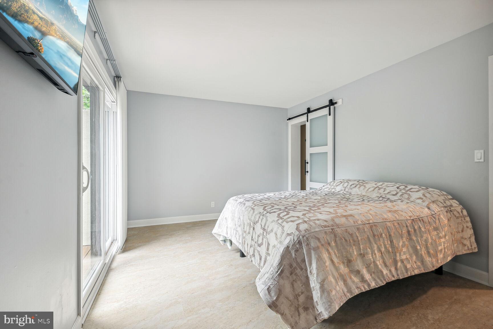 1635 Valencia Way Reston, VA 20190 - Photo 15 of 22 a bedroom with a bed and a window